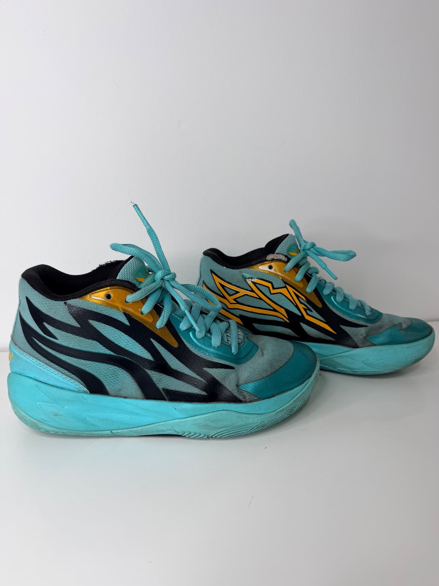 Preloved Puma Melo basketball shoes teal and gold size 5.5
