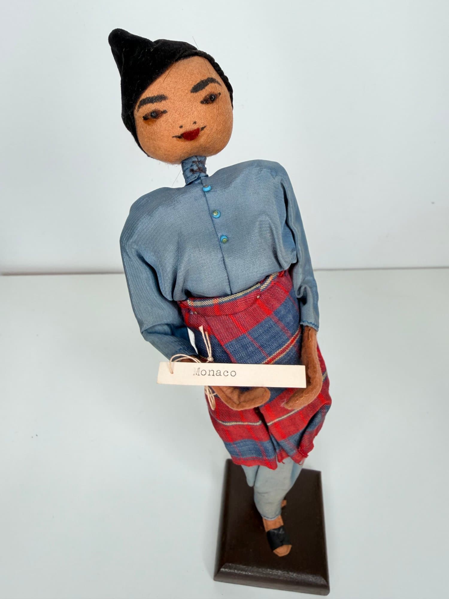 Vintage Monaco souvenir cloth doll figurine on wood stand